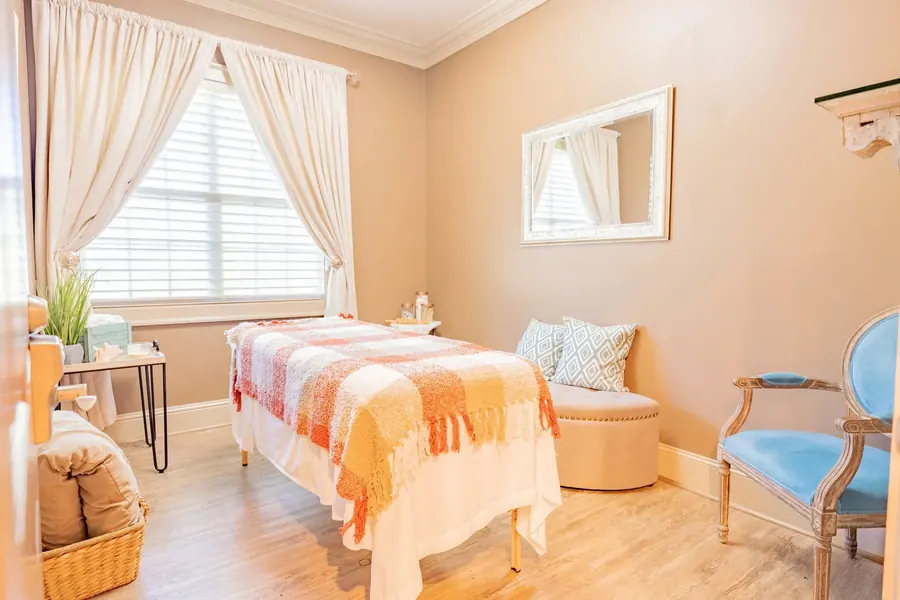 Residential bedroom with window and bedside furniture